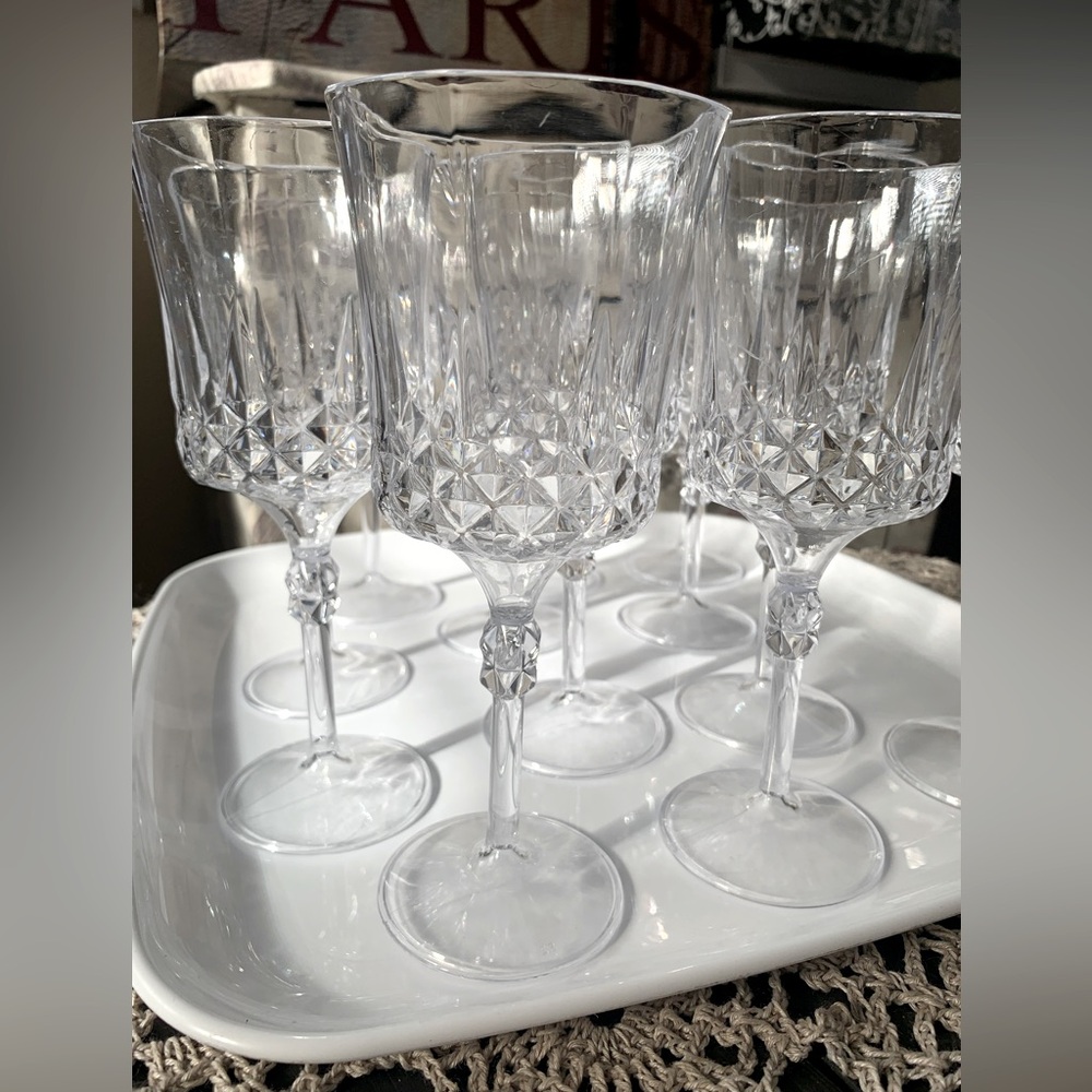 12 Plastic Wine Glasses. Some signs of use on a couple of them.